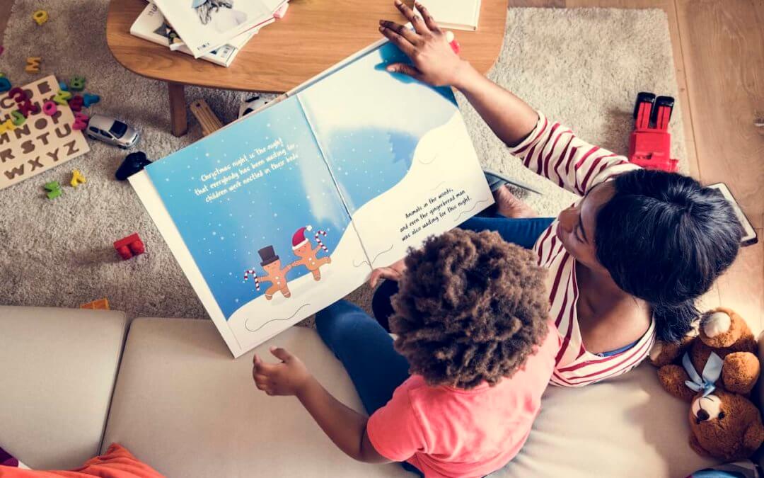 Mother reading a book with her child.