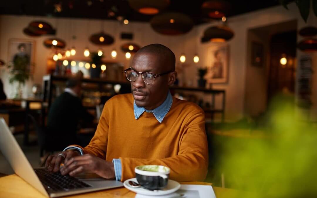 Author working on a book in a coffee shop.